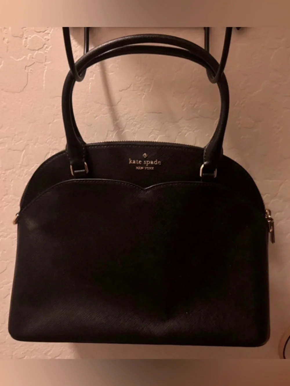 kate spade black dome-shaped satchel with gold logo